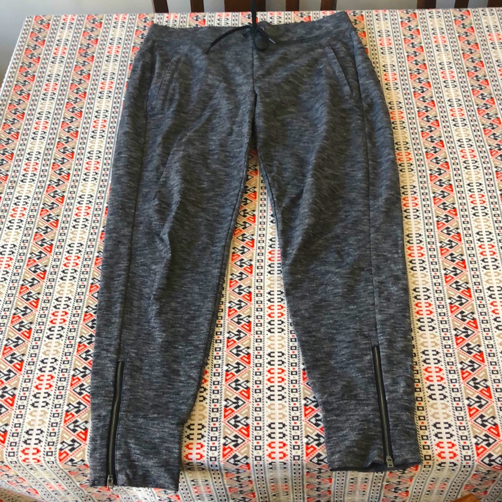Athleta gray joggers with zip pockets and zip ankles